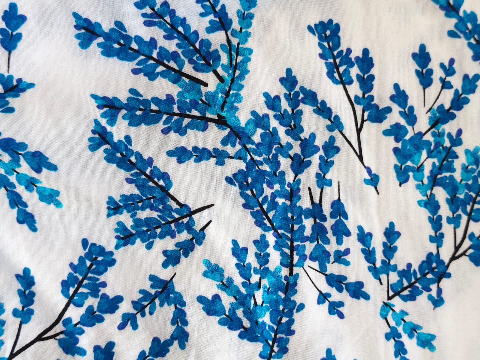 White shirt with a blue botanical print