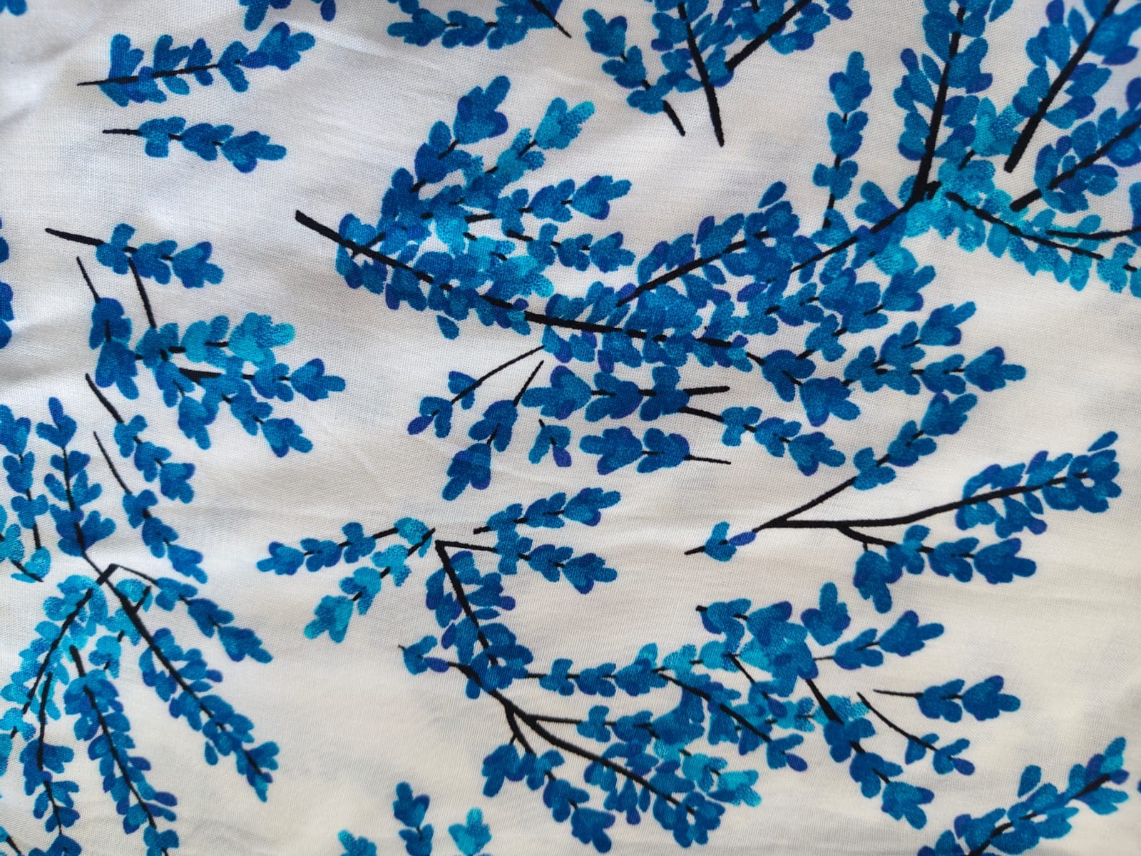 White shirt with a blue botanical print